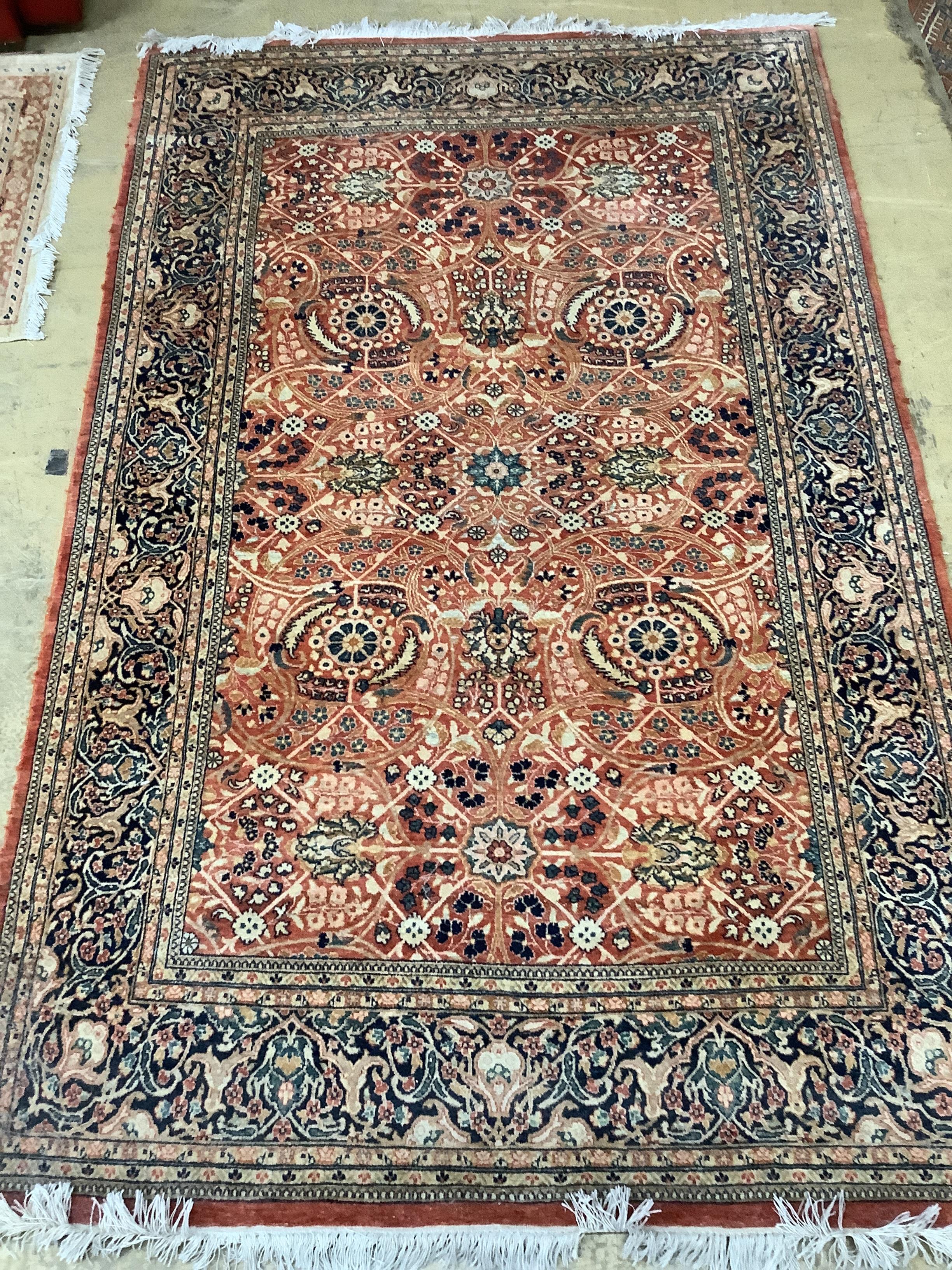 A North West Persian red ground rug, 220 x 137cm